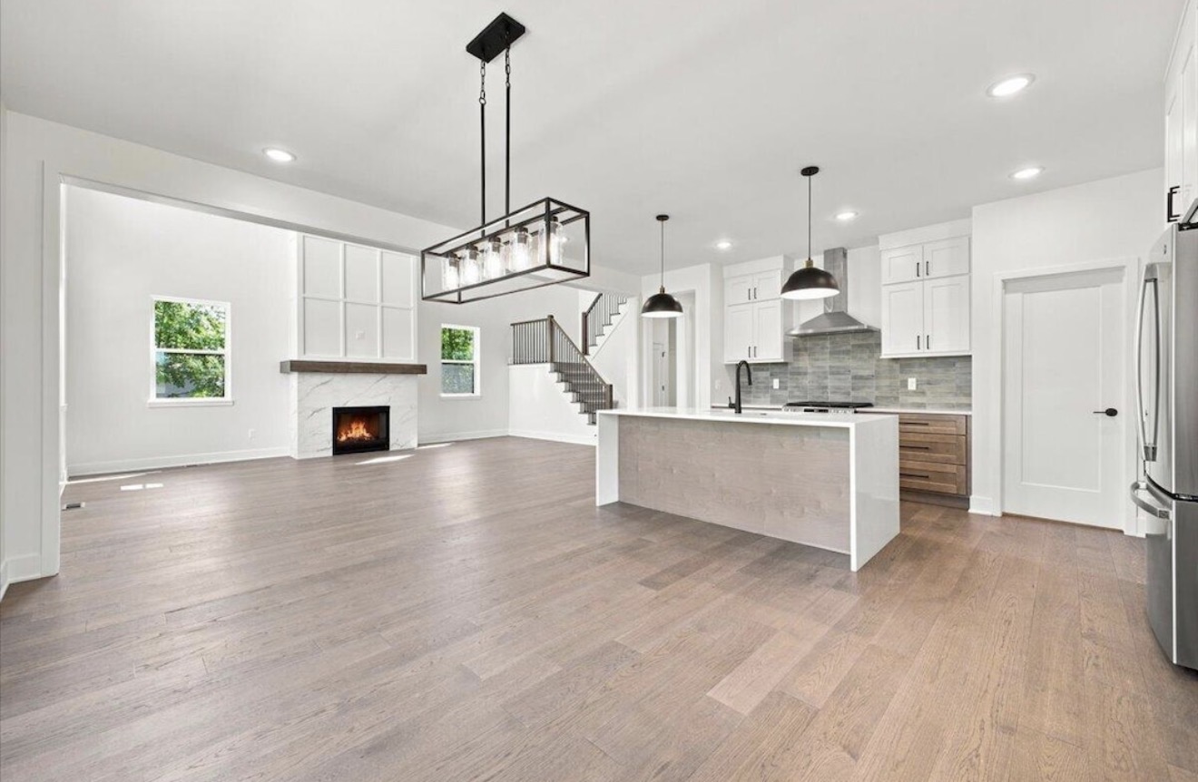 Kitchen and great room with open staircase