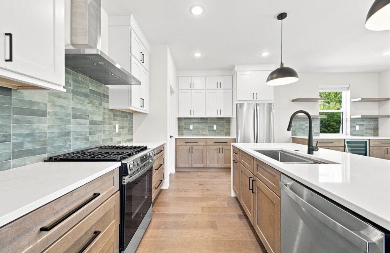 Kitchen work area with quartz counters and wood cabinetry