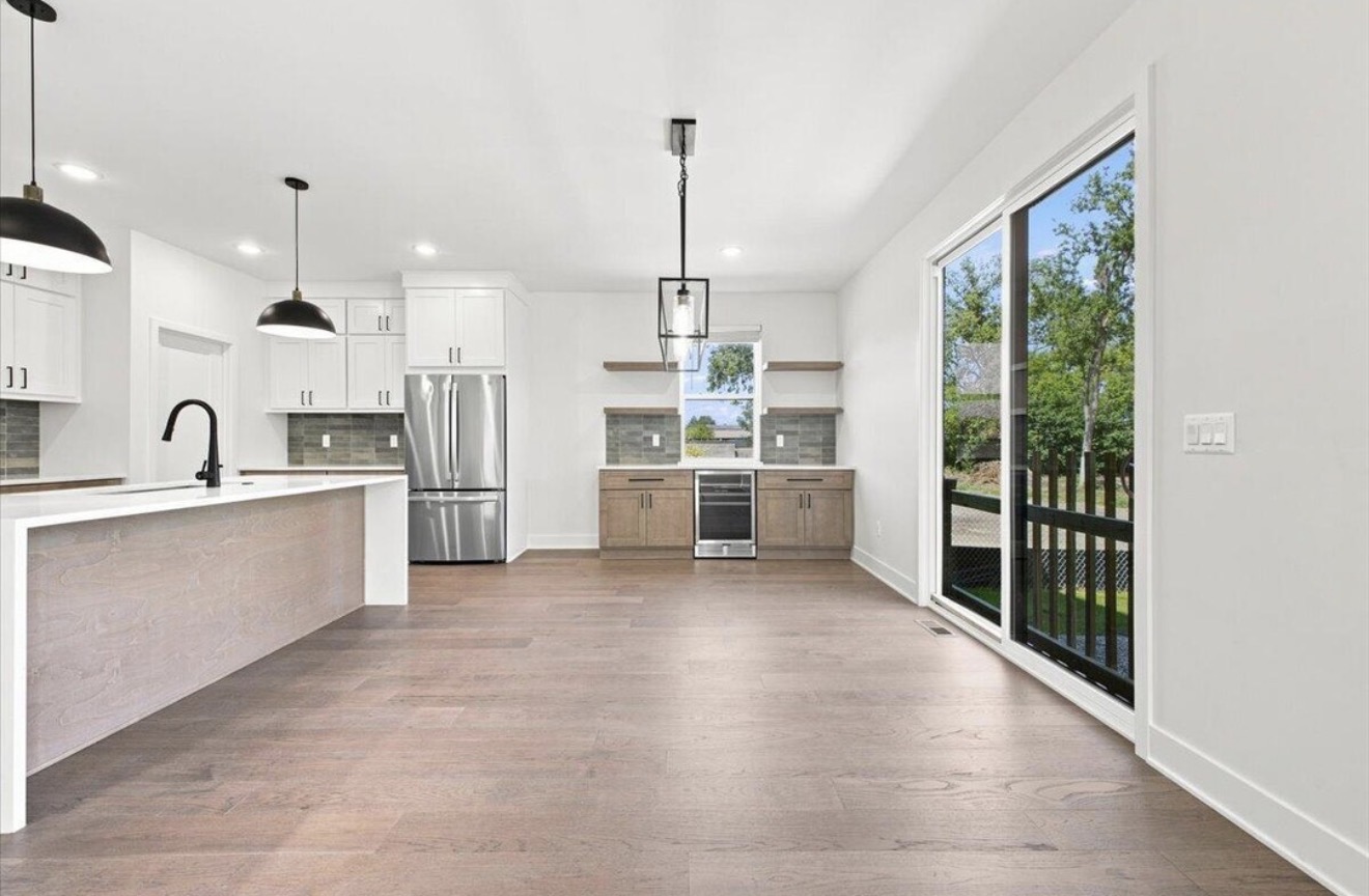 Kitchen and dining area with access to the backyard