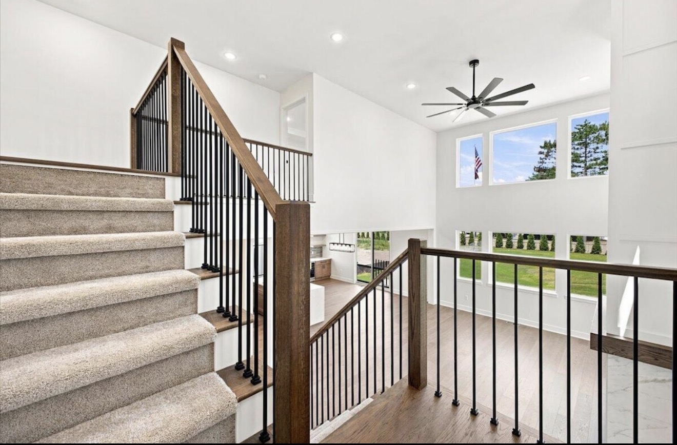 Open staircase overlooking the two-story great room